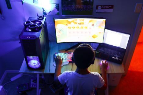 School boy using artificial intelligence on computer for learning purpose or for solving some education work problems.