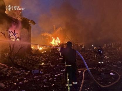 Firefighters battling a fire at a building in the Kyiv region of Ukraine.