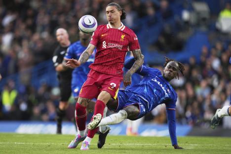 Chelsea's Trevoh Chalobah challenging Liverpool's Darwin Nunez for the ball.