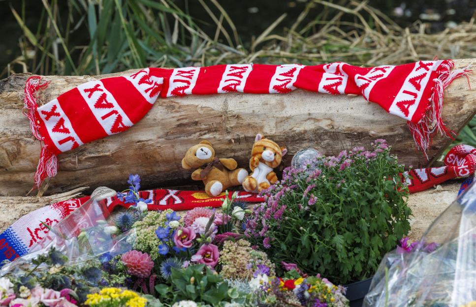 Tributes at a cycle path where a teenager was murdered.