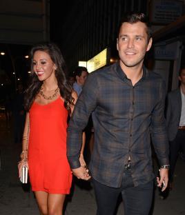 Michelle Keegan and Mark Wright holding hands.