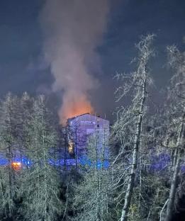 Nighttime photo of a building fire in a French ski resort.