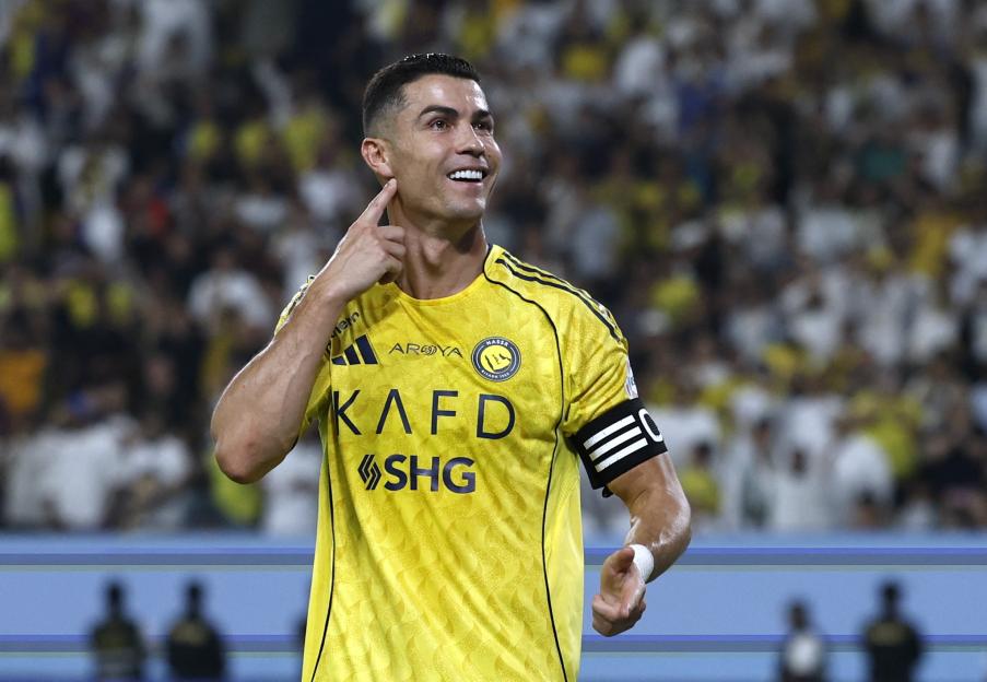 Al Nassr's Cristiano Ronaldo celebrates scoring their fifth goal.