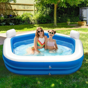 Two girls in a blue inflatable pool.