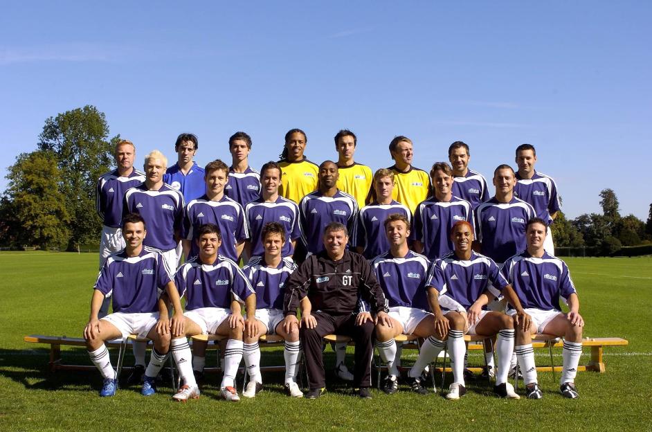 Team photo of soccer players and coach.