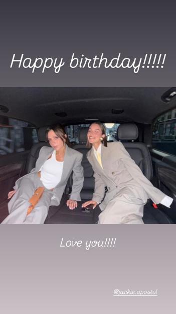 Jackie Apostel and another woman in business suits sit in the back seat of a car.