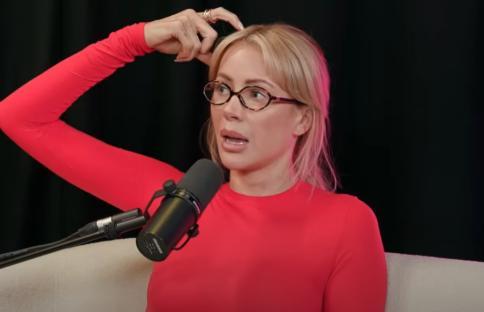 Olivia Attwood on a podcast, speaking into a microphone.