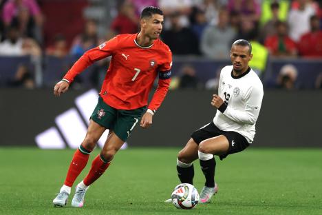 Cristiano Ronaldo of Portugal dribbling the ball during a soccer match.