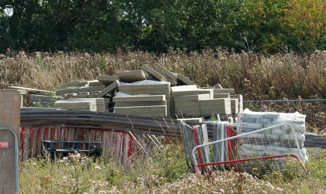 Abandoned construction materials at a bankrupt development site.