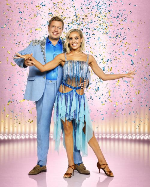 Tom Skinner and Amy Dowden in a dance pose with confetti falling around them.