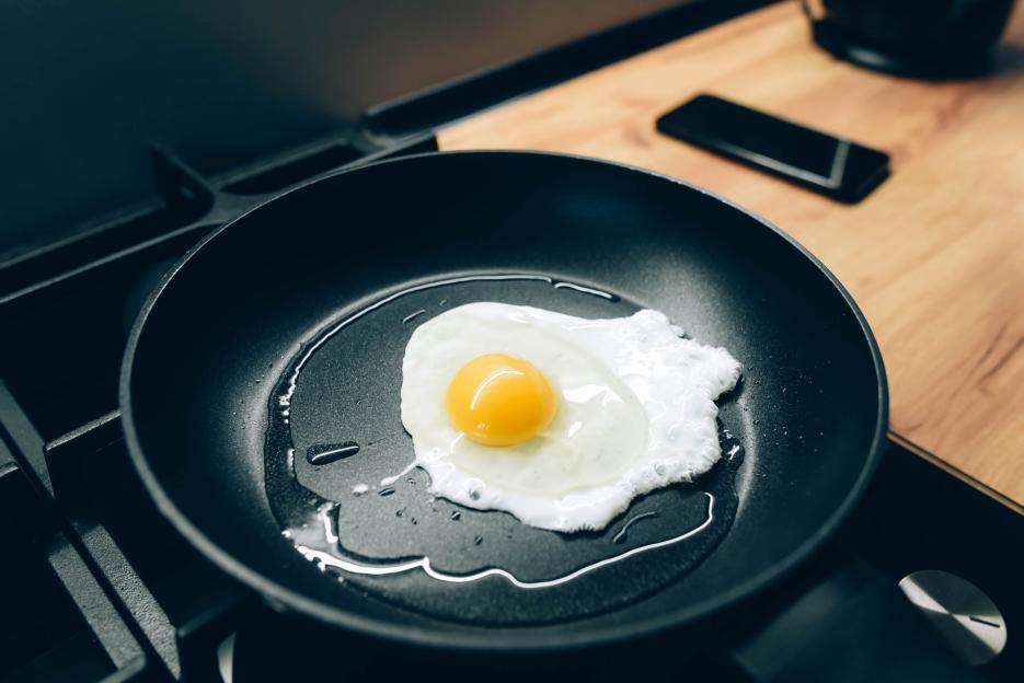 Fried egg in a frying pan.