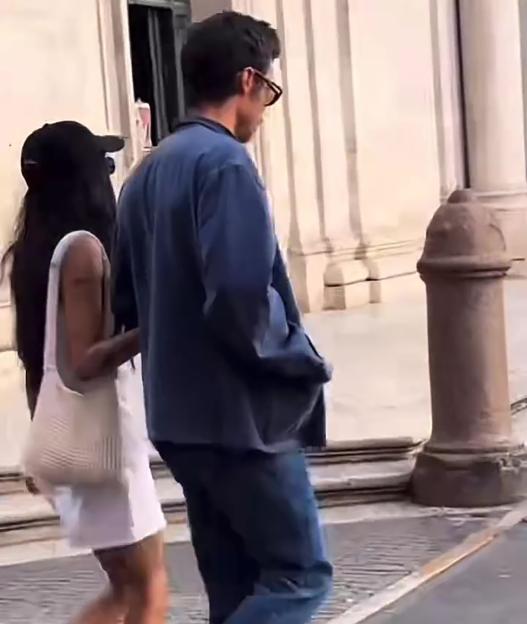 Harry Styles and Zoe Kravitz walking in Rome.