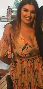 Woman in floral dress.