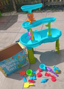 Waterfall beach table with accessories.