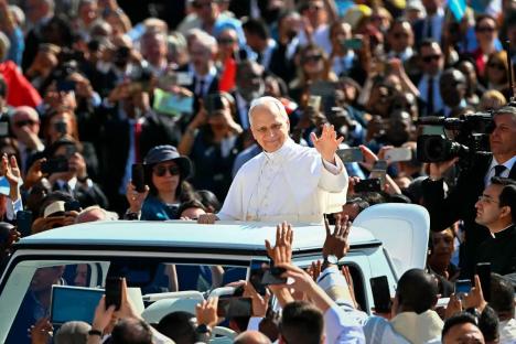 Pope Leo XIV rides in popemobile ahead of inaugural mass, greets crowd