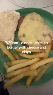 Chicken burger with cheese, chips, and a bun.