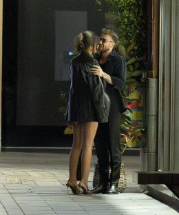 Sam Thompson and Samie Elishi embracing at a party.