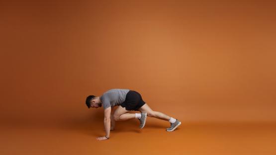 Man performing a mountain climber exercise.