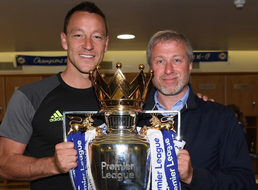 John Terry and Roman Abramovich holding the Premier League trophy.