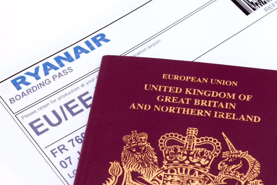 UK passport and Ryanair boarding pass.