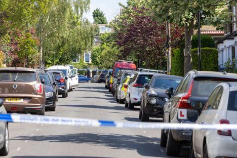 Police and emergency vehicles on a residential street.