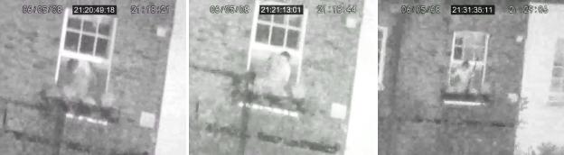 CCTV footage of Mark Saunders at a window during a police siege.