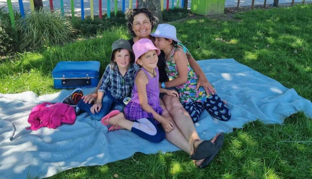 Photo of a mother and her three missing children.