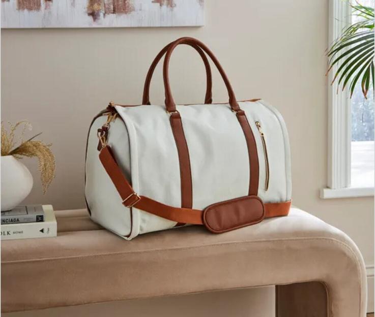 Cream and tan faux leather fold-out holdall bag.