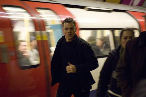 Matt Damon running in a subway station.