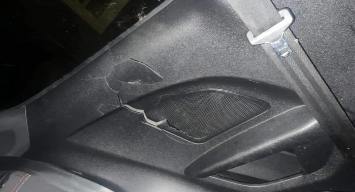 Damaged car door panel.