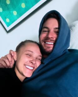 JoJo Siwa and Chris Hughes cuddling.