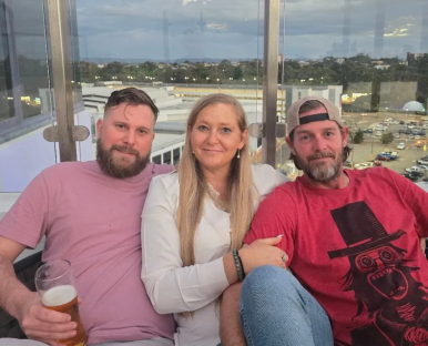 Three people posing for a photo.