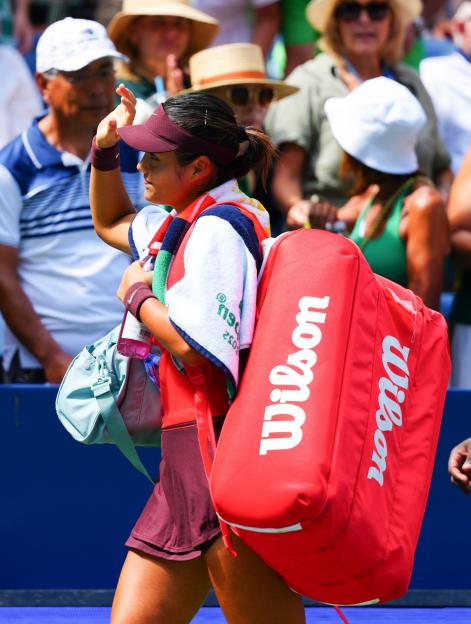 Emma Raducanu leaving the court after a tennis match.