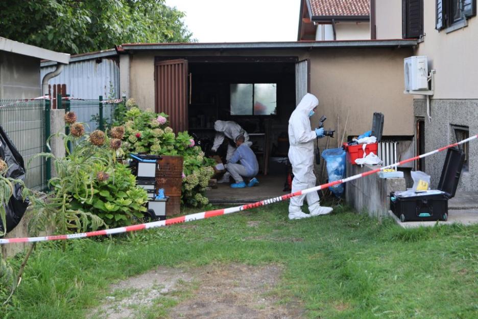 Forensic investigators collecting evidence at a crime scene.
