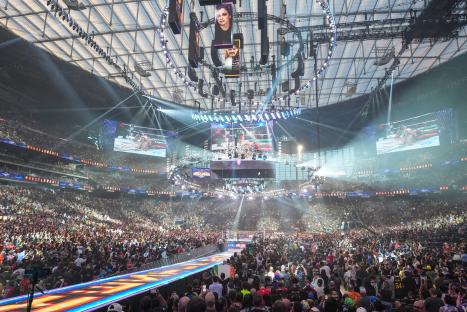 General view of WrestleMania at a packed stadium.