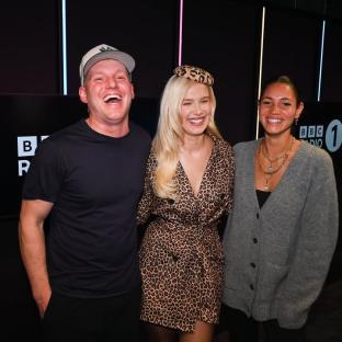 Three people smiling for a photo.