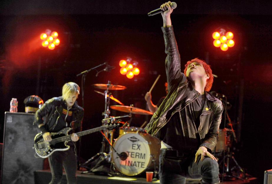 Gerard Way and Mikey Way of My Chemical Romance performing on stage.