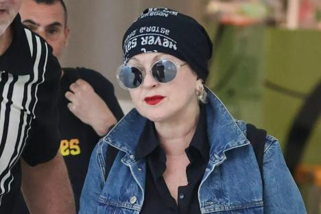 Rarely-seen pop icon looks incredible at 71 as she arrives in Australia for tour
