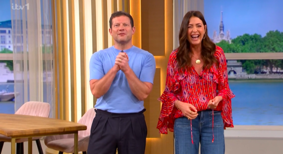 Screenshot of two smiling presenters on a television show.