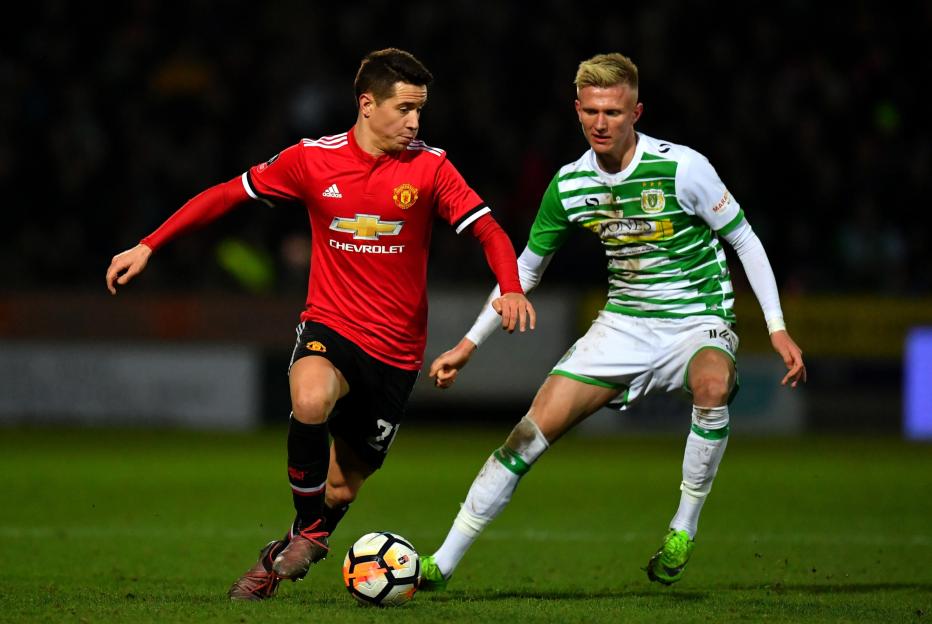 Ander Herrera of Manchester United and Sam Surridge of Yeovil Town during The Emirates FA Cup Fourth Round match.