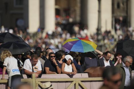 Clergy on a rooftop awaiting the papal conclave results.