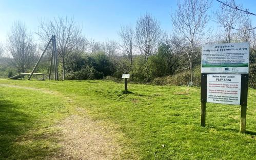Park play area with signs.