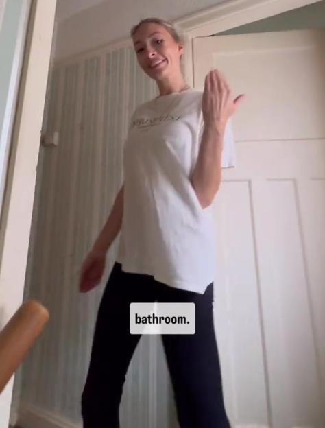 A woman showing her bathroom.