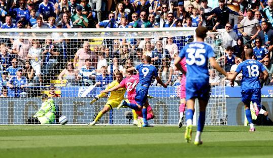 Jamie Vardy scoring a goal for Leicester City.