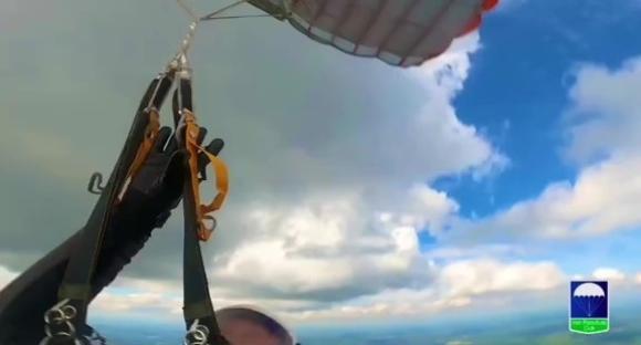 First-person skydiving video showing a tangled parachute.