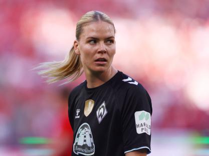 Juliane Wirtz of Werder Bremen looks on during a soccer match.