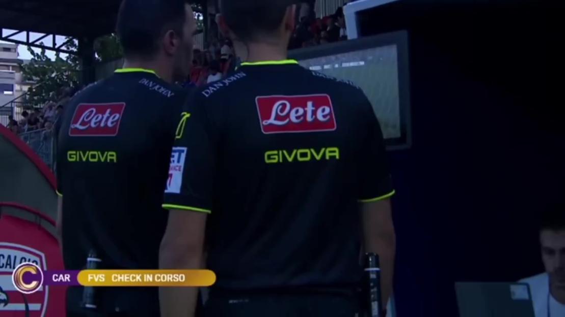 Referees reviewing a video replay.