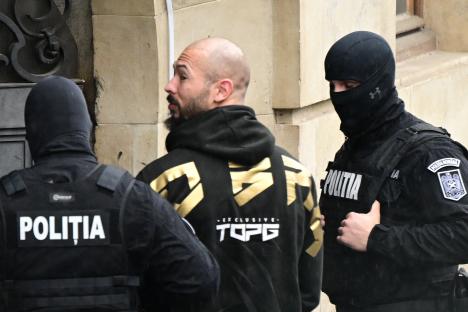 Andrew Tate escorted by Romanian police.