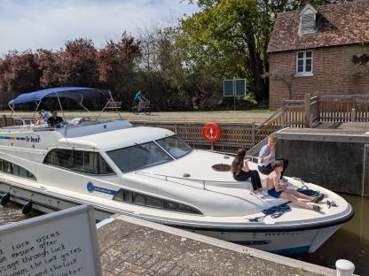 Family on a Le Boat in a lock.