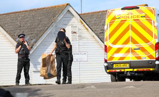 Police officers at the scene of a body recovery.
